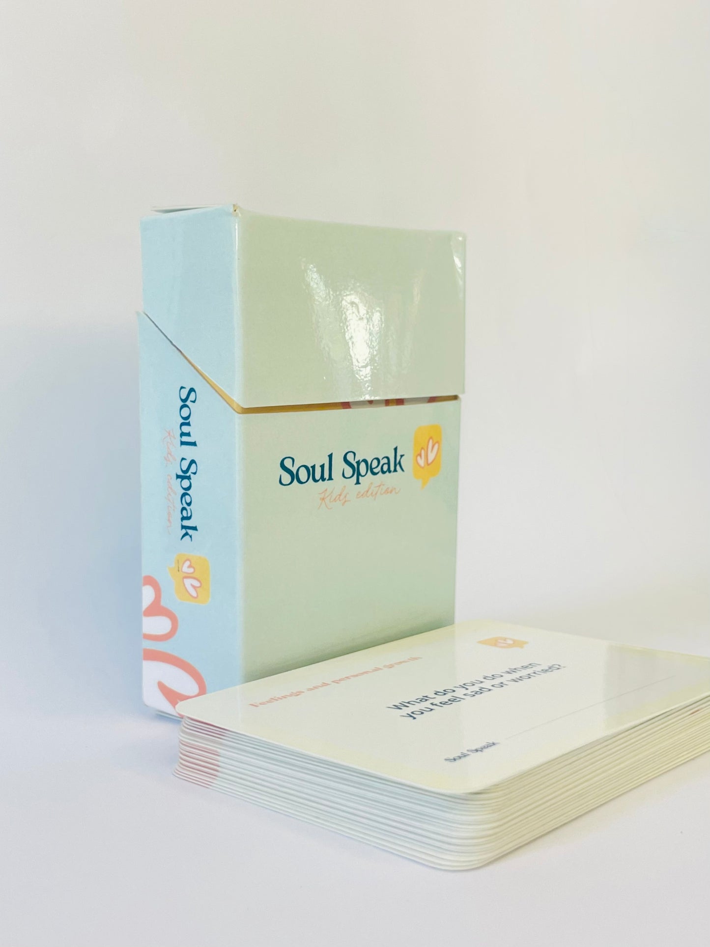 Front Face of Soul Speak Kids Edition Card deck titled with a light blue and green box on a white background.