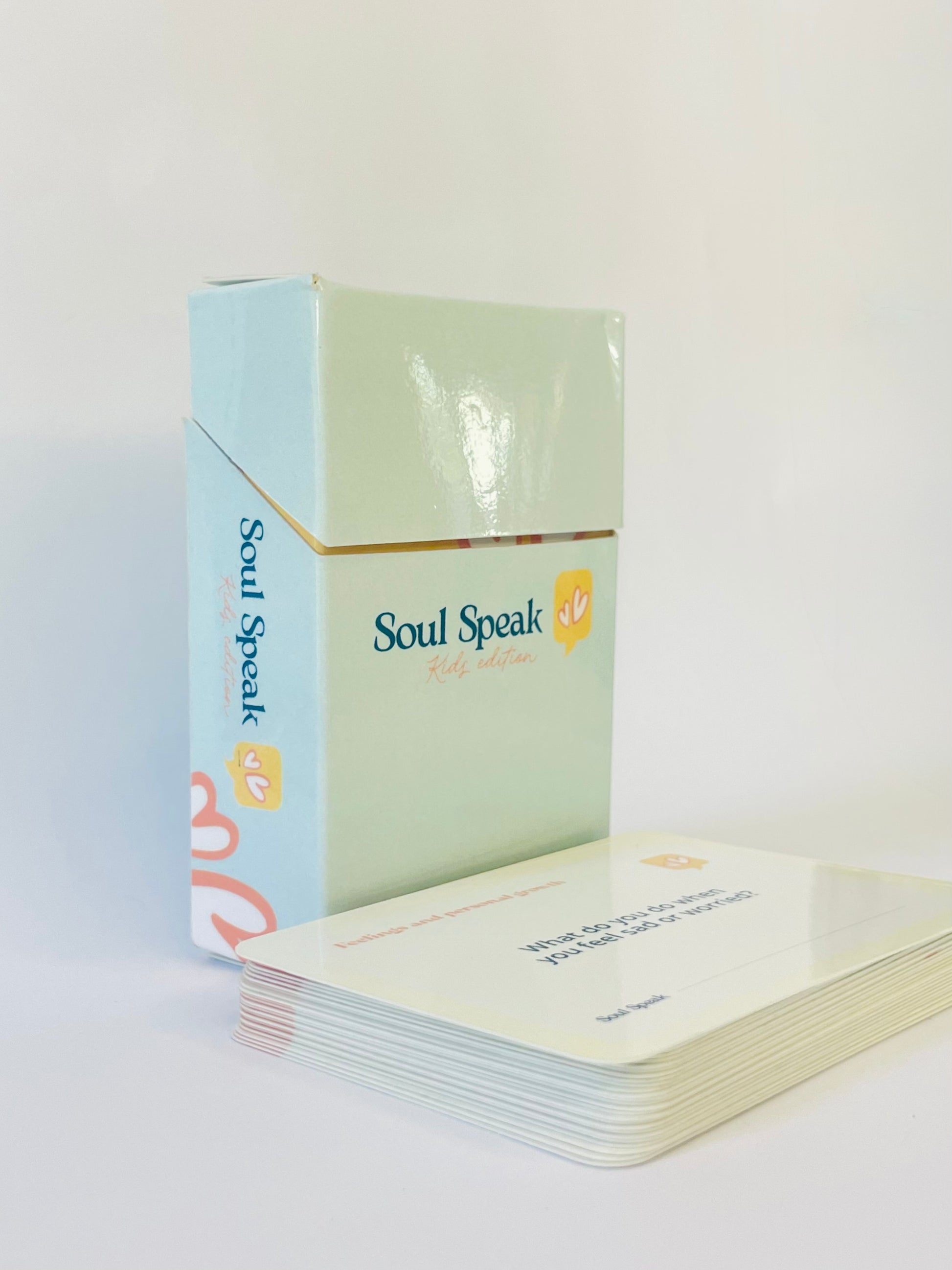 Front Face of Soul Speak Kids Edition Card deck titled with a light blue and green box on a white background.